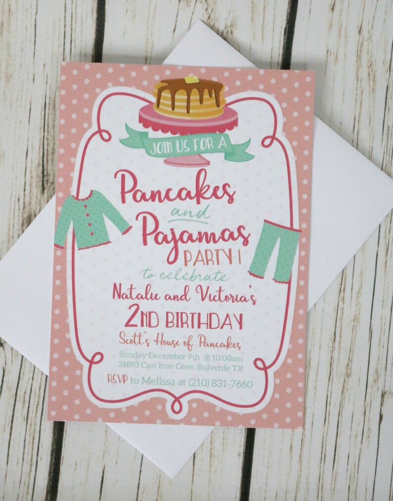 May include: Pink invitation with white polka dots, featuring a stack of pancakes, a pair of pajamas, and the text "Join us for a Pancakes and Pajamas Party to celebrate Natalie and Victoria's 2nd Birthday. Scott's House of Pancakes Sunday December 9th @ 10:00am 31893 Cast Iron Cove, Bulverde TX RSVP to Melissa at (210) 831-7660"
