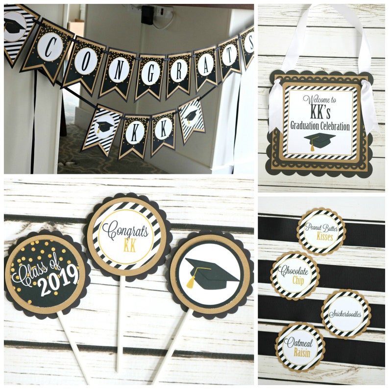 May include: Black and gold graduation party decorations with a banner that says "Congrats", cupcake toppers with a graduation cap and the text "Congrats KK", and a sign that says "Welcome to KK's Graduation Celebration".