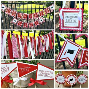 May include: Graduation party decorations in red and white with the name Lexi. Decorations include a banner, pennants, cupcake toppers, and a welcome sign.
