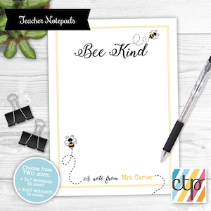 May include: Bee Kind notepad with a bee design. Choose from two sizes: 5x7 and 8x10. Each notepad has 50 sheets. A note from Mrs. Carter.