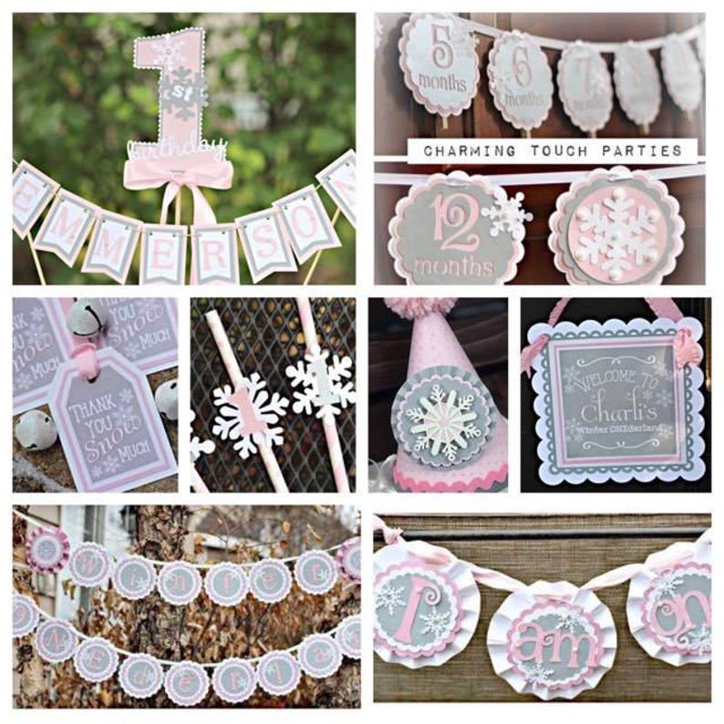 May include: A collection of party decorations in pink, gray, and white, featuring snowflake and winter-themed designs. Includes banners, a birthday cake topper, party hats, and gift tags. The decorations are suitable for a winter-themed birthday or baby shower.