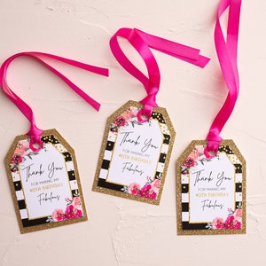 May include: Three gift tags with pink ribbons. Each tag has a gold glitter border, black and white stripes, and a floral design with pink and red flowers. The text reads "Thank You for making my 40th birthday fabulous."