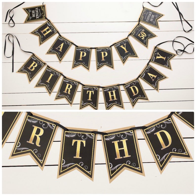May include: Black and gold happy birthday banner with a vintage dude design. The banner is made of paper and has a black background with gold lettering. The banner is strung together with black ribbon.