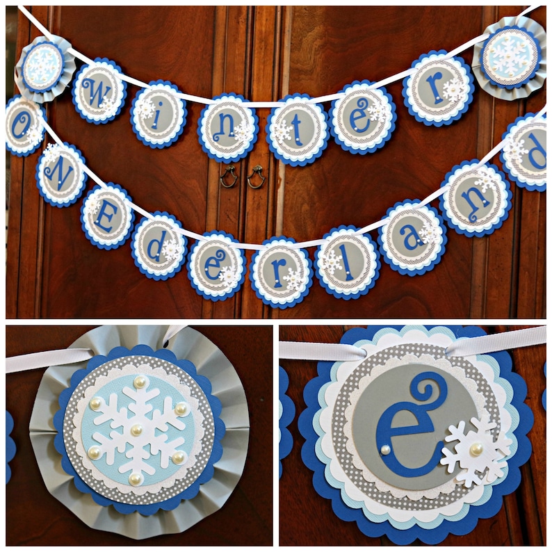 May include: A winter wonderland themed banner with blue and gray scalloped circles. Each circle has a white snowflake and a letter spelling out "Winter Wonderland".