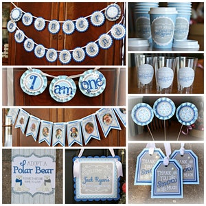 May include: A set of winter wonderland themed party decorations for a first birthday. The decorations include a banner that says "Winter Wonderland", a banner that says "I am one", a banner with photos, a sign that says "Adopt a Polar Bear", a sign that says "Welcome to Jack Ryan's Winter Wonderland", and thank you tags that say "Thank You Snow Much".