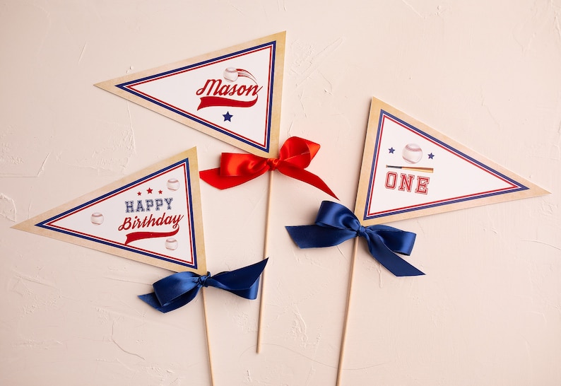 May include: Three baseball-themed pennant flags with red, white, and blue accents. The flags read "Mason", "Happy Birthday", and "One".