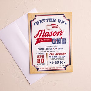 May include: A baseball-themed birthday party invitation for a boy named Mason turning one. The invitation features a red, white, and blue color scheme with a baseball graphic and the text "Batter Up" and "Mason is turning One". The invitation also includes details about the party, such as the date, time, and location.