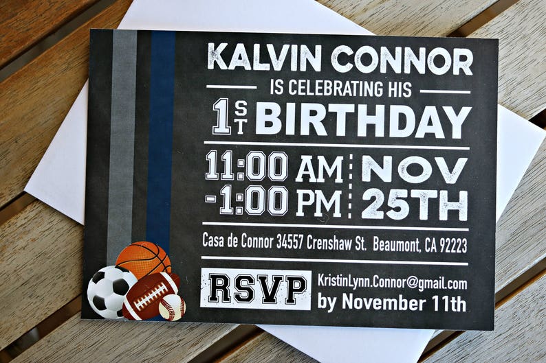 May include: A black and white chalkboard style invitation with a blue and gray stripe border. The invitation reads "Kalvin Connor is celebrating his 1st Birthday 11:00 AM: NOV -1:00 PM: 25TH Casa de Connor 34557 Crenshaw St. Beaumont, CA 92223 RSVP KristinLynn.Connor@gmail.com by November 11th". The invitation has a graphic of a soccer ball, football, and basketball.