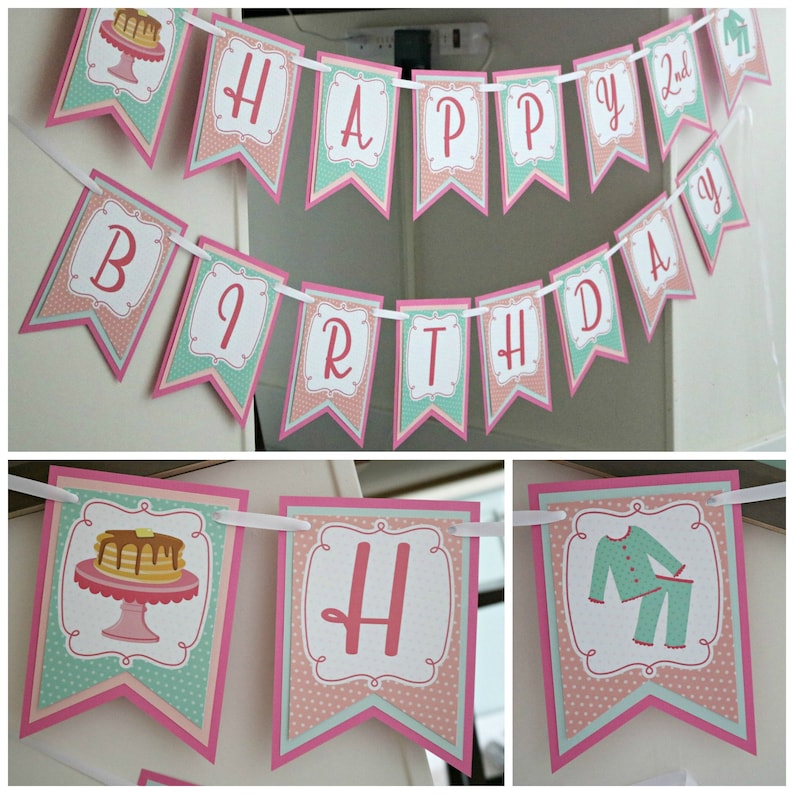 May include: A pink and green banner with the words "Happy 2nd Birthday" in white. The banner has a polka dot pattern and features images of pancakes and pajamas.