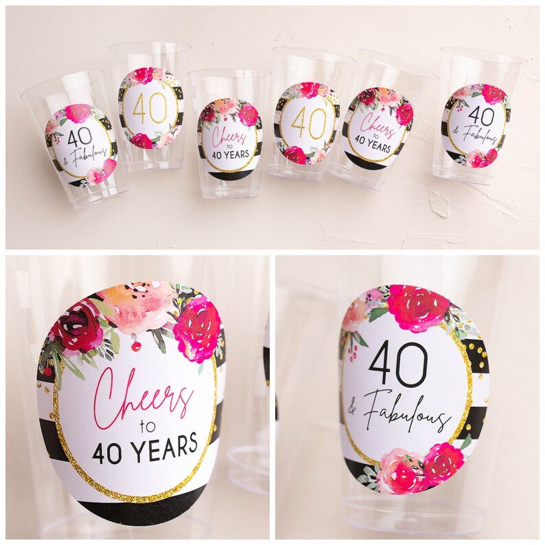 May include: Set of six clear plastic cups with black and white striped and floral patterned round stickers. The stickers feature the text "Cheers to 40 Years" and "40 & Fabulous".