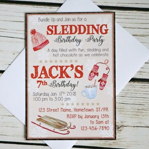 May include: A rectangular birthday party invitation card featuring a red knit hat, red mittens, a mug of hot chocolate, and a wooden sled. The text reads: Bundle Up and Join us for a SLEDDING Birthday Party, JACK'S 7th Birthday, Jan. 17th 2018, 1:00 pm to 3:00 pm, 123 Street Name, Hometown. ST/PR, RSVP by January 13th to Sam at 123-456-7890.
