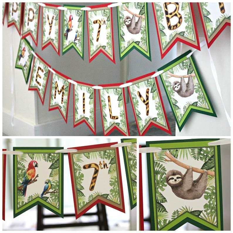 May include: A green, red, and brown jungle-themed banner with the words "Happy 7th Birthday Emily" and images of sloths and parrots.