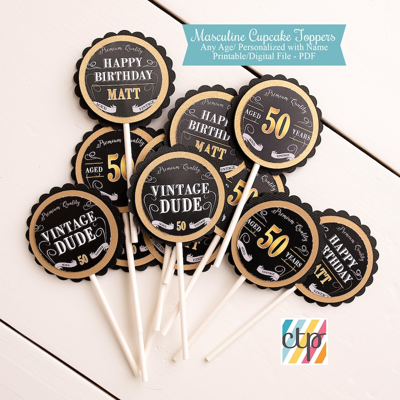 May include: Black and gold cupcake toppers with various designs, including "Happy Birthday Matt", "Aged 50 Years", and "Vintage Dude".