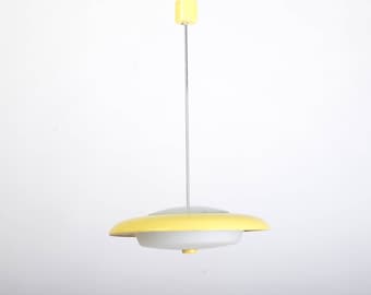 May include: A yellow and white pendant light fixture with a circular design. The light fixture is suspended from the ceiling by a thin metal rod.