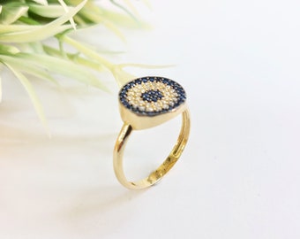 Round evil eye ring in k14 gold with zirconia gemstones