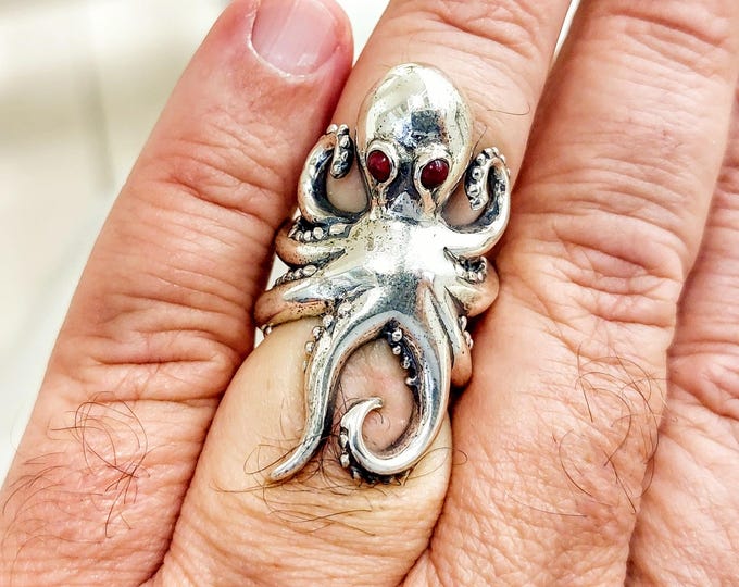 Sterling silver octopus ring with garnet eyes – adjustable statement ring for ocean lovers
