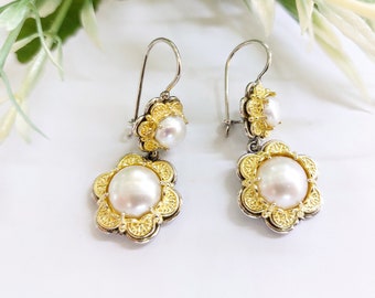 Pearl earrings with gold floral bezels in sterling silver 925