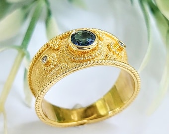 Blue topaz ring in 18k gold with diamonds and byzantine finish