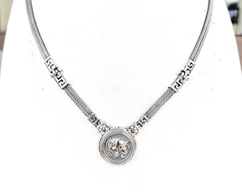 Athena coin necklace in sterling silver with hand-woven chain