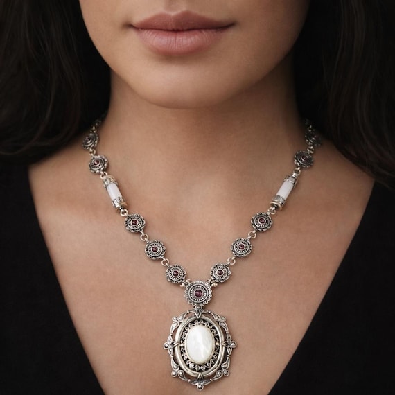 Baroque silver necklace adorned with mother of pearl and garnet gemstones, fine byzantine jewelry