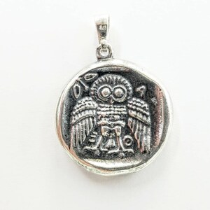 Athena the Goddess replica coin in sterling silver 925. A silver coin pendant with Goddess Athena on one side and Athena owl (with wings open) on the other.