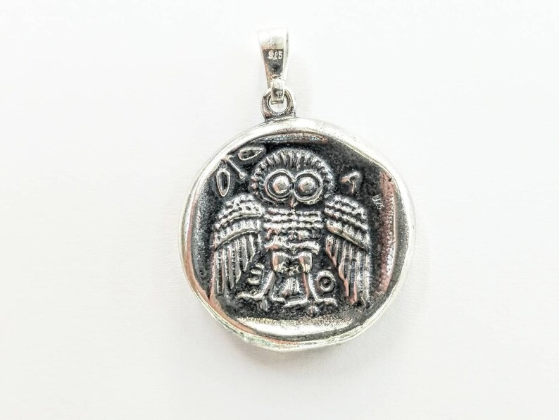 Athena the Goddess replica coin in sterling silver 925. A silver coin pendant with Goddess Athena on one side and Athena owl (with wings open) on the other.