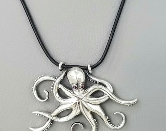Artisanal octopus necklace on sleek black leather cord, handmade silver octopus jewelry