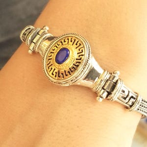 Greek meander bracelet in two-tone silver with lapis lazuli.