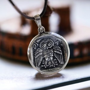 Athena the Goddess replica coin in sterling silver 925. A silver coin pendant with Goddess Athena on one side and Athena owl (with wings open) on the other.