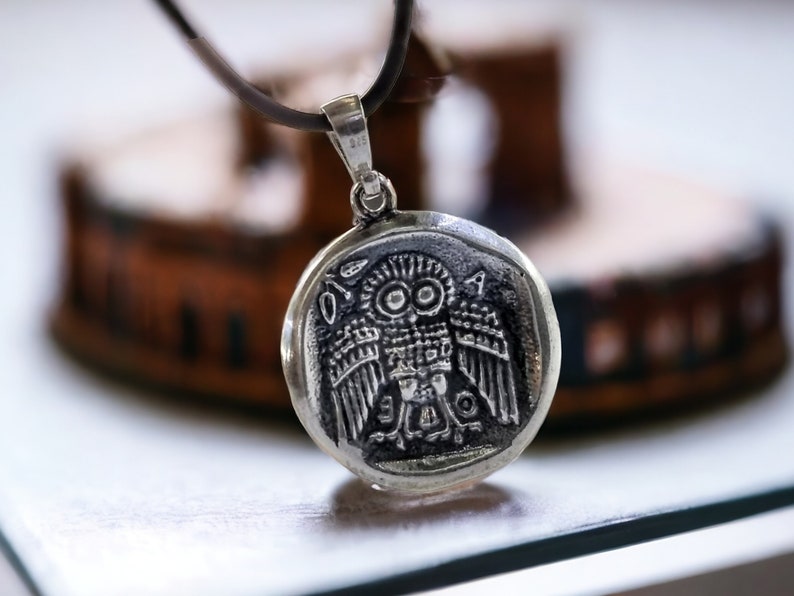 Athena the Goddess replica coin in sterling silver 925. A silver coin pendant with Goddess Athena on one side and Athena owl (with wings open) on the other.