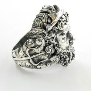 Silver ring depicting the ancient Greek God, Poseidon and his trident. Silver Neptune ring. The ring is handmade in sterling silver and is available in all sizes. Poseidon was the Greek God of the sea