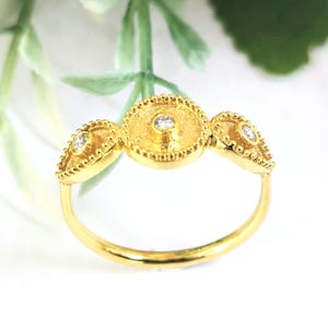 Elegant 18k Gold, Diamond Ring  with granulated bezels and geometric byzantine themes.