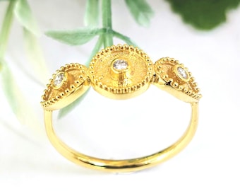 Elegant 18k Gold, Diamond Ring  with granulated bezels and geometric byzantine themes.