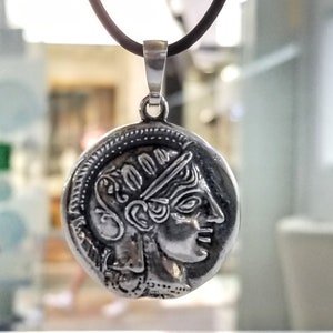 Athena the Goddess replica coin in sterling silver 925. A silver coin pendant with Goddess Athena on one side and Athena owl (with wings open) on the other.