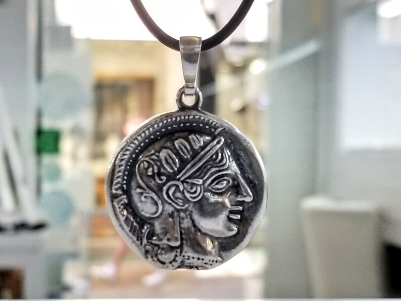 Athena the Goddess replica coin in sterling silver 925. A silver coin pendant with Goddess Athena on one side and Athena owl (with wings open) on the other.