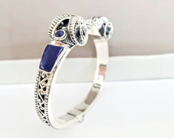Sterling Silver Ram Heads Bracelet with Lapis Lazuli Inlays and Byzantine perforations on the shank.