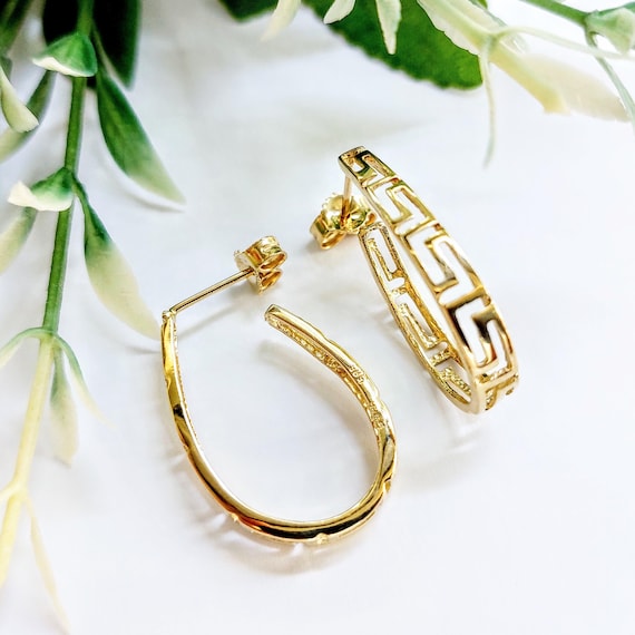 Greek key hoop earrings in 14K gold.