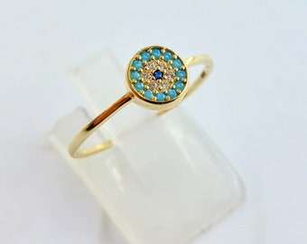 K14 gold evil eye ring with turquoise and zircon gemstones.