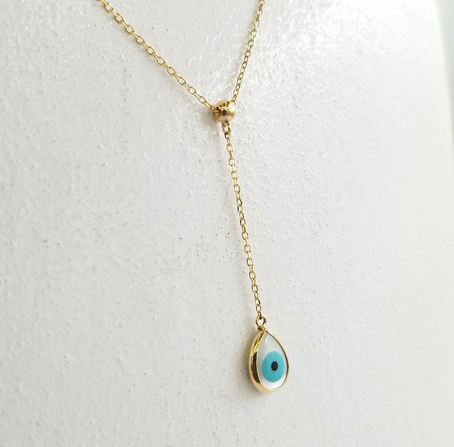Evil eye lariat necklace in k14 solid gold with mother of pearl