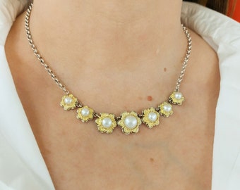 Pearl Necklace: Silver necklace with gold plated byzantine bezels.