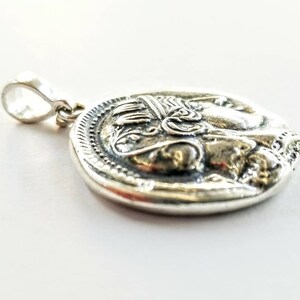 Athena the Goddess replica coin in sterling silver 925. A silver coin pendant with Goddess Athena on one side and Athena owl (with wings open) on the other.