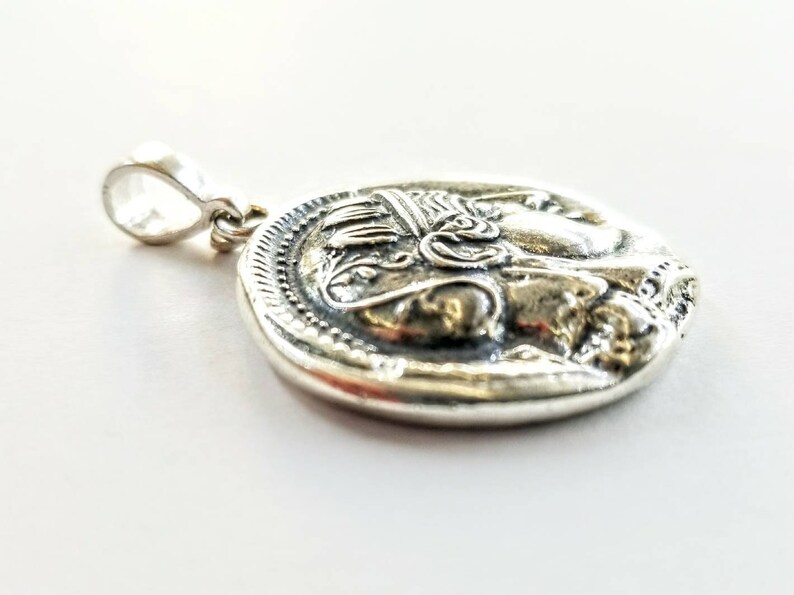 Athena the Goddess replica coin in sterling silver 925. A silver coin pendant with Goddess Athena on one side and Athena owl (with wings open) on the other.