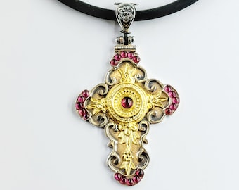 Handmade Byzantine rcoss in sterling silver with garnets and gold plated decorations.