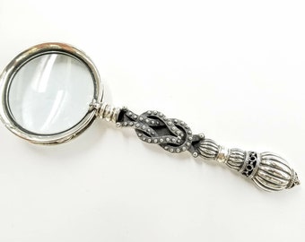 Silver magnifying glass