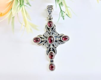 Garnet elegance: Silver byzantine cross pendant with intricate details