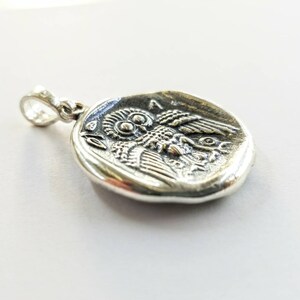 Athena the Goddess replica coin in sterling silver 925. A silver coin pendant with Goddess Athena on one side and Athena owl (with wings open) on the other.