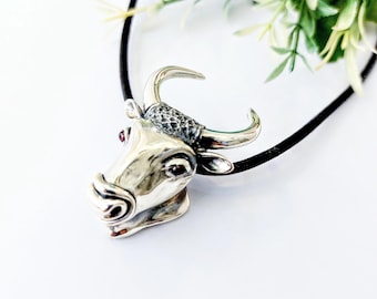 Sterling silver bull necklace on black leather chord
