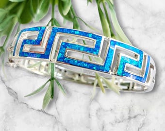 Greek key bracelet with blue Kyocera Opal inlays, rigid meander cuff with perforated design