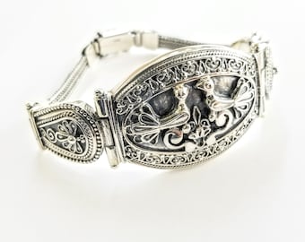 Victoriaanse zilveren volière: handgemaakte gebeeldhouwde armband met vogelthema