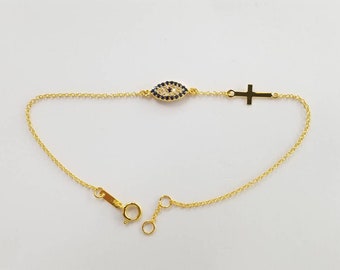 Evil eye bracelet with cross in solid k14 gold.